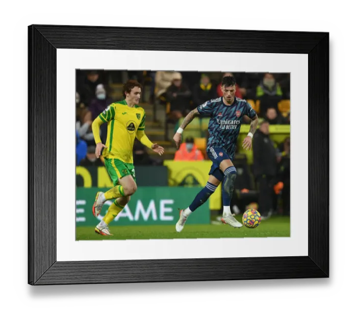 Framed Print : Arsenal's Ben White Outmaneuvers Norwich's Joshua Sargent in Premier League Clash