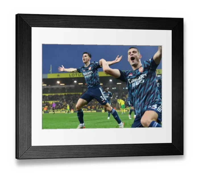 Framed Print : Arsenal's Tierney and Xhaka: Double Strike Celebration vs Norwich City (December 2021)