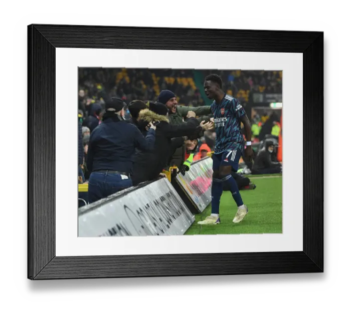 Framed Print : Saka Scores: Arsenal Fans Celebrate at Norwich City's Carrow Road Framed Print : Saka Scores: Arsenal Fans Celebrate at Norwich City's Carrow Road
