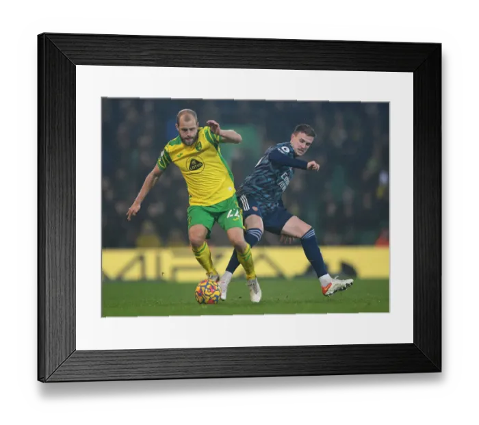 Framed Print : Clash at Carrow Road: Holding vs. Pukki in the Premier League Battle between Norwich and Arsenal