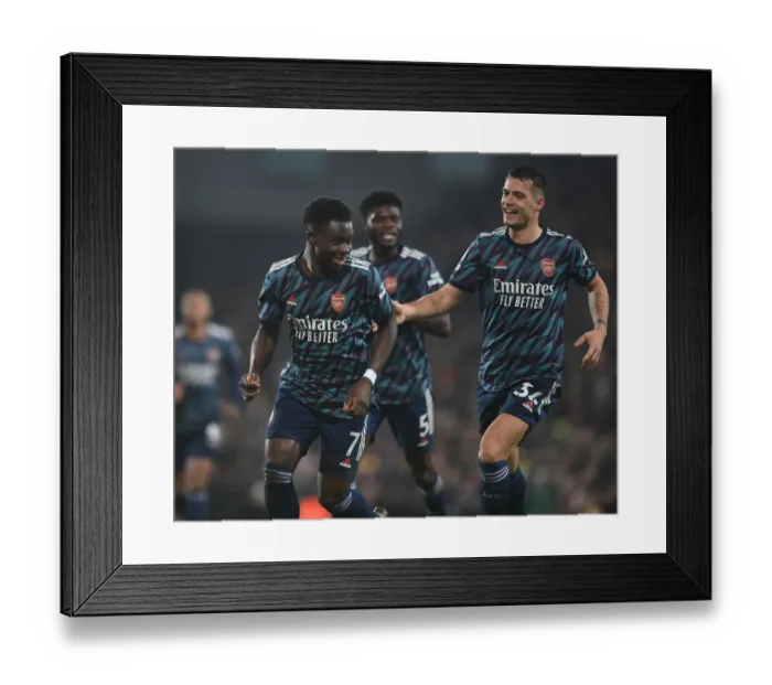 Framed Print : Saka and Xhaka Celebrate Arsenal's Third Goal Against Norwich City (Premier League 2021-22) Framed Print : Saka and Xhaka Celebrate Arsenal's Third Goal Against Norwich City (Premier League 2021-22)