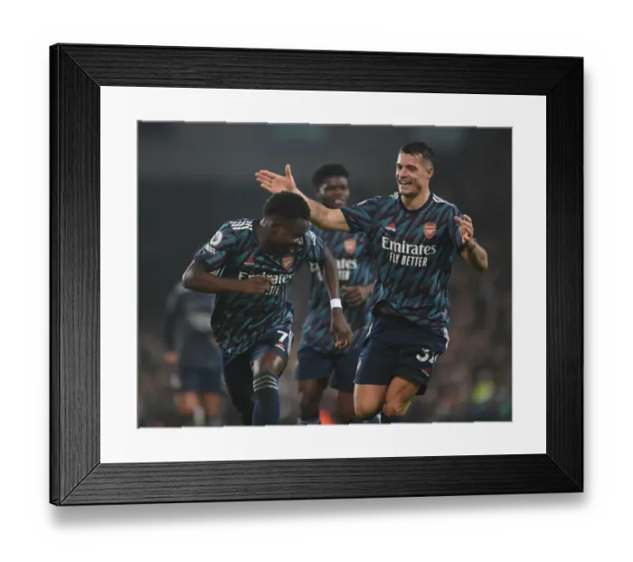 Framed Print : Saka and Xhaka Celebrate Arsenal's Victory over Norwich City in the Premier League