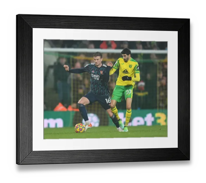 Framed Print : Norwich City vs Arsenal: Holding vs Lees-Melou Battle in Premier League Clash Framed Print : Norwich City vs Arsenal: Holding vs Lees-Melou Battle in Premier League Clash
