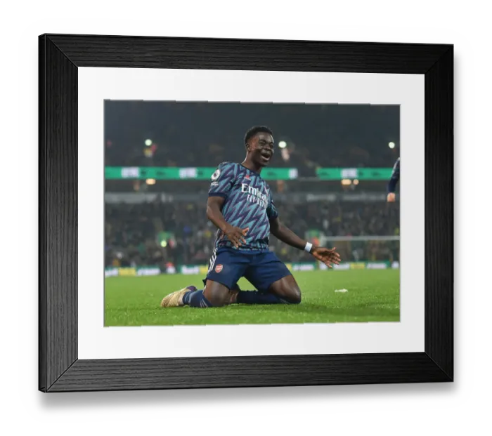 Framed Print : Saka Scores Thriller: Arsenal's Triumphant 3-1 Victory Over Norwich City in the Premier League (2021-22)