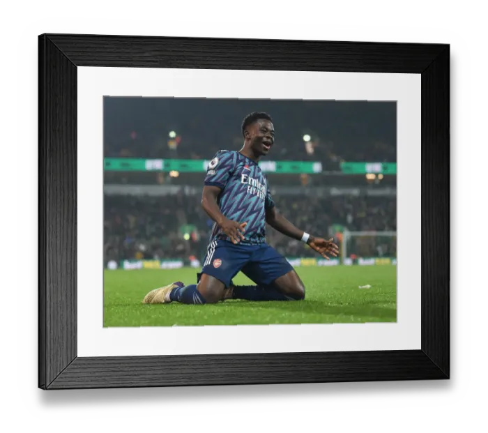 Framed Print : Saka Scores Triumph: Arsenal's 3-0 Victory Over Norwich City in the 2021-22 Premier League