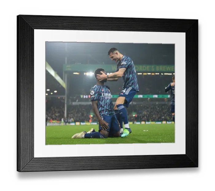Framed Print : Saka and Xhaka Celebrate Arsenal's Goals Against Norwich City (December 2021)
