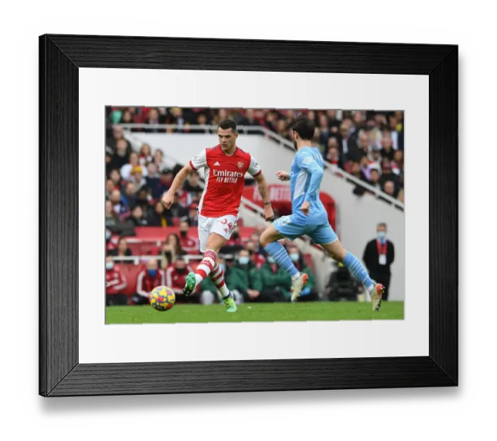 Framed Print : Granit Xhaka: In Action for Arsenal Against Manchester City, Premier League 2021-22 Framed Print : Granit Xhaka: In Action for Arsenal Against Manchester City, Premier League 2021-22