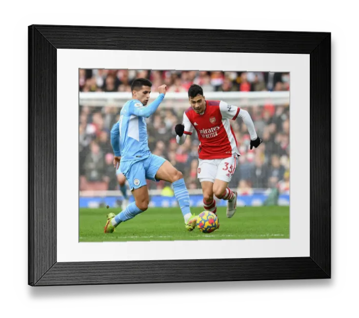 Framed Print : Arsenal vs Manchester City: Gabriel Martinelli Clashes with Joao Cancelo in Premier League Showdown