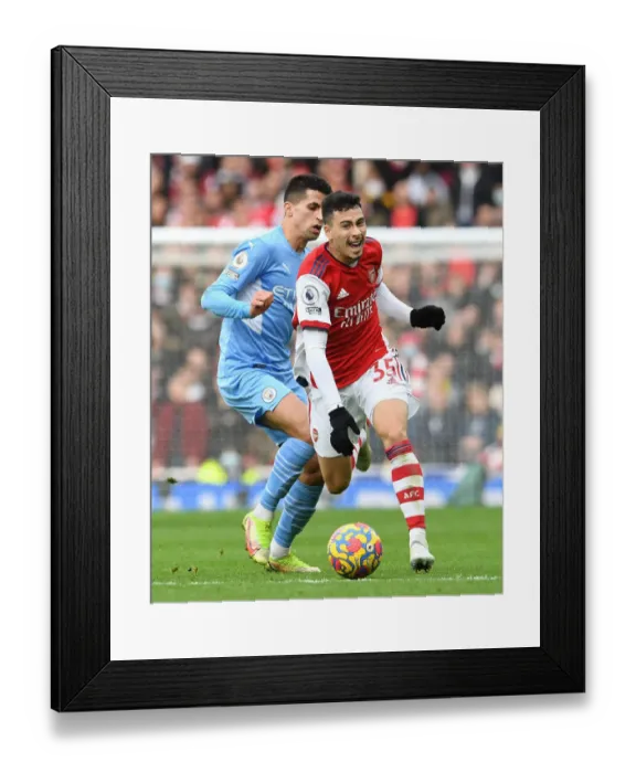 Framed Print : Martinelli vs. Cancelo: A Premier League Showdown - Arsenal vs. Manchester City Framed Print : Martinelli vs. Cancelo: A Premier League Showdown - Arsenal vs. Manchester City