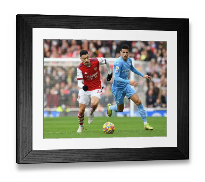 Framed Print : Martinelli vs Cancelo: A Premier League Battle at the Emirates