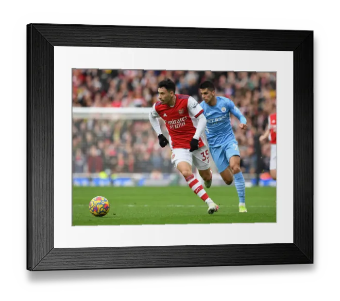 Framed Print : Martinelli vs. Cancelo: A Fiery Face-Off in Arsenal's Battle against Manchester City Framed Print : Martinelli vs. Cancelo: A Fiery Face-Off in Arsenal's Battle against Manchester City