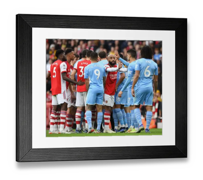 Framed Print : Arsenal's Lacazette Tries to Rally Team Against Manchester City in Premier League Clash Framed Print : Arsenal's Lacazette Tries to Rally Team Against Manchester City in Premier League Clash