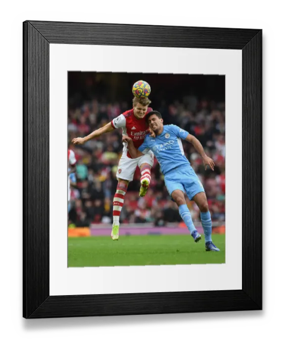 Framed Print : Clash at the Emirates: Arsenal vs Manchester City - A Heading Battle Between Odegaard and Rodri Framed Print : Clash at the Emirates: Arsenal vs Manchester City - A Heading Battle Between Odegaard and Rodri