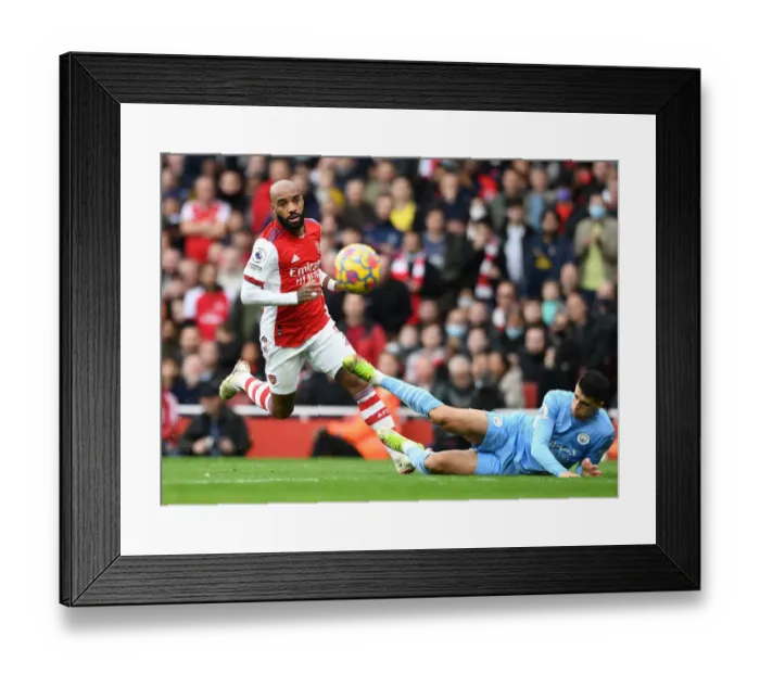 Framed Print : Arsenal vs Manchester City: Lacazette vs Cancelo - Premier League Clash at Emirates Stadium (2021-22)