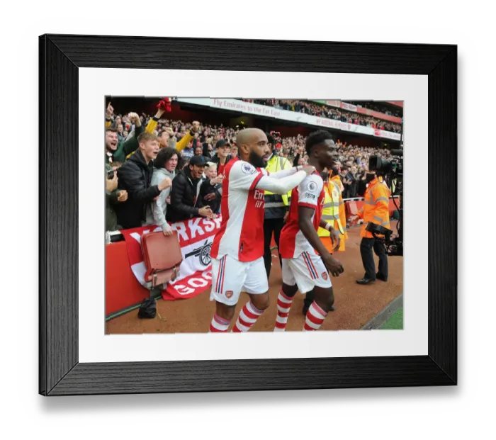 Framed Print : Arsenal's Saka and Lacazette: Celebrating a Goal Against Manchester City (2021-22) Framed Print : Arsenal's Saka and Lacazette: Celebrating a Goal Against Manchester City (2021-22)