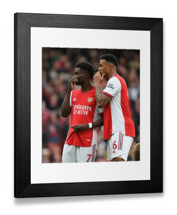 Framed Print : Arsenal's Saka and Gabriel Face Off Against Manchester City in Premier League Showdown Framed Print : Arsenal's Saka and Gabriel Face Off Against Manchester City in Premier League Showdown