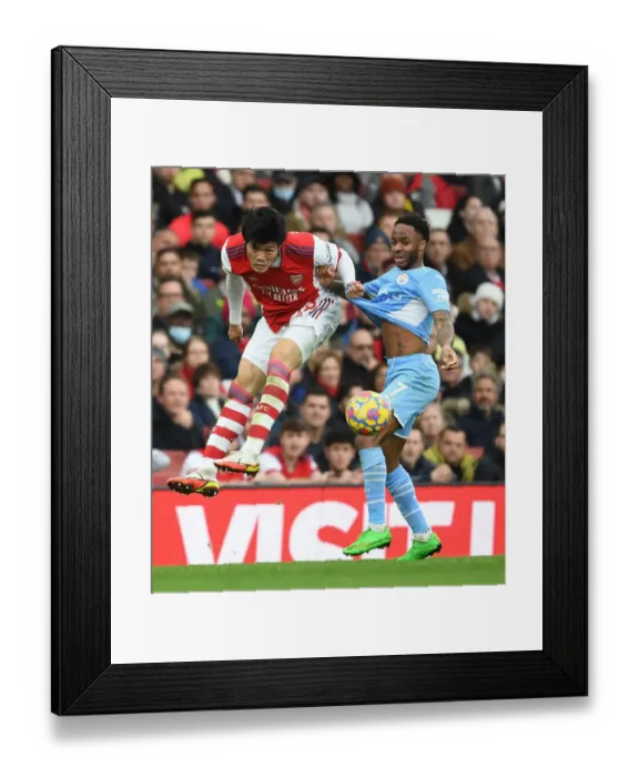 Framed Print : Clash of Titans: Tomiyasu vs Sterling - Arsenal's Unyielding Defender Stands Strong Against Manchester City's Star