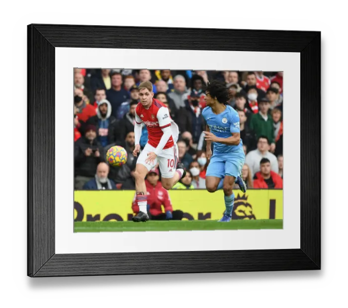 Framed Print : Arsenal's Emile Smith Rowe Outmaneuvers Manchester City's Nathan Ake in Premier League Clash Framed Print : Arsenal's Emile Smith Rowe Outmaneuvers Manchester City's Nathan Ake in Premier League Clash
