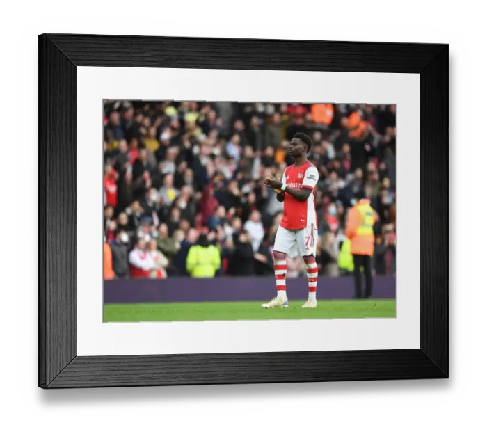 Framed Print : Arsenal's Bukayo Saka Celebrates with Fans After Hard-Fought Arsenal v Manchester City Match, Premier League 2021-22