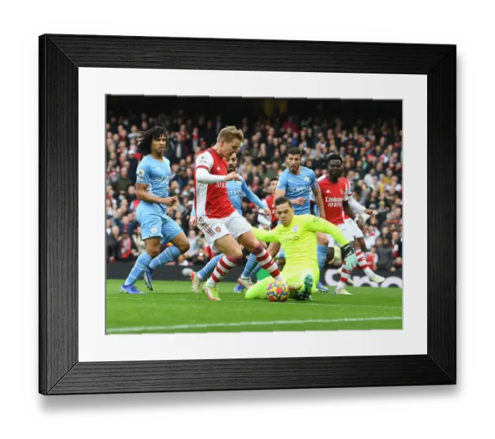 Framed Print : Odegaard vs Ederson: A Premier League Battle at Emirates Stadium - Arsenal vs Manchester City Framed Print : Odegaard vs Ederson: A Premier League Battle at Emirates Stadium - Arsenal vs Manchester City