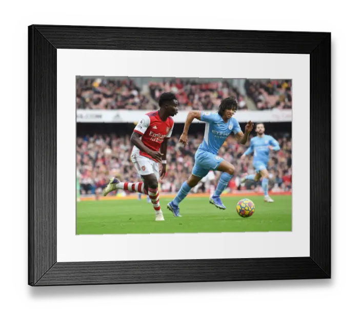 Framed Print : Saka Scores Spectacular Goal: Arsenal's Star Outwits Manchester City's Ake in Epic Premier League Clash Framed Print : Saka Scores Spectacular Goal: Arsenal's Star Outwits Manchester City's Ake in Epic Premier League Clash
