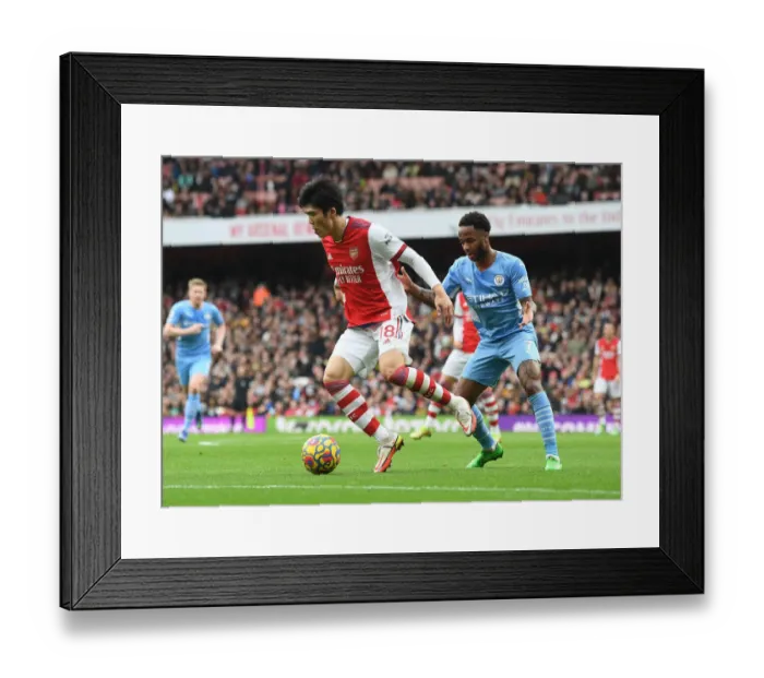 Framed Print : Tomiyasu vs Sterling: A Premier League Showdown at the Emirates Framed Print : Tomiyasu vs Sterling: A Premier League Showdown at the Emirates