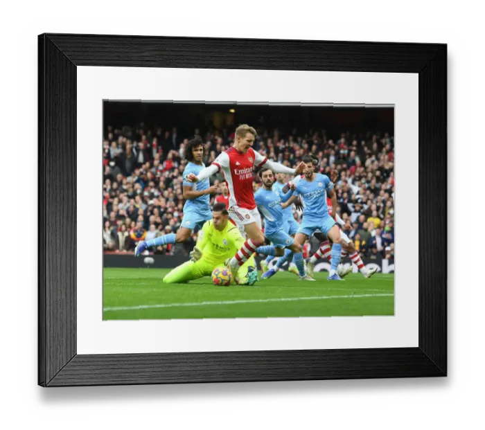Framed Print : Odegaard vs Ederson: A Premier League Showdown at the Emirates