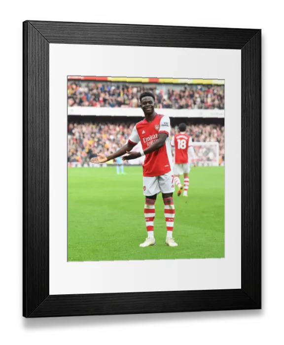 Framed Print : Saka Scores the Winner: Arsenal Triumph Over Manchester City in Premier League Showdown Framed Print : Saka Scores the Winner: Arsenal Triumph Over Manchester City in Premier League Showdown