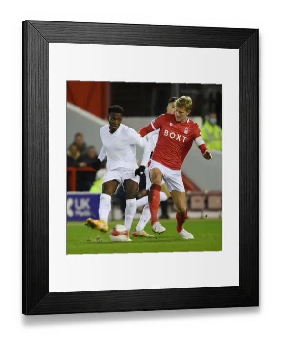 Framed Print : Arsenal's Eddie Nketiah Faces Off Against Nottingham Forest's Joe Worrall in FA Cup Third Round Clash Framed Print : Arsenal's Eddie Nketiah Faces Off Against Nottingham Forest's Joe Worrall in FA Cup Third Round Clash