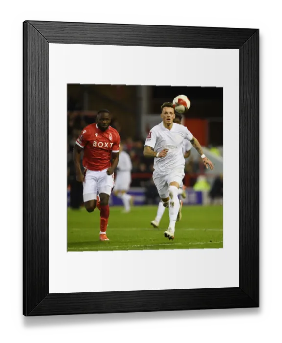Framed Print : Arsenal's Ben White Faces Off Against Nottingham Forest's Keinan Davis in FA Cup Clash Framed Print : Arsenal's Ben White Faces Off Against Nottingham Forest's Keinan Davis in FA Cup Clash