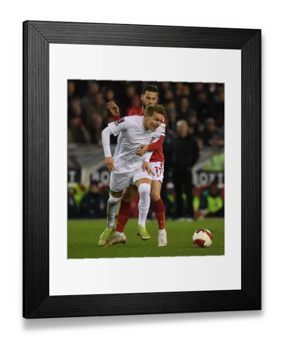 Framed Print : Martin Odegaard vs Philip Zinckernagel: A Battle in the FA Cup Third Round Clash Between Nottingham Forest and Arsenal Framed Print : Martin Odegaard vs Philip Zinckernagel: A Battle in the FA Cup Third Round Clash Between Nottingham Forest and Arsenal