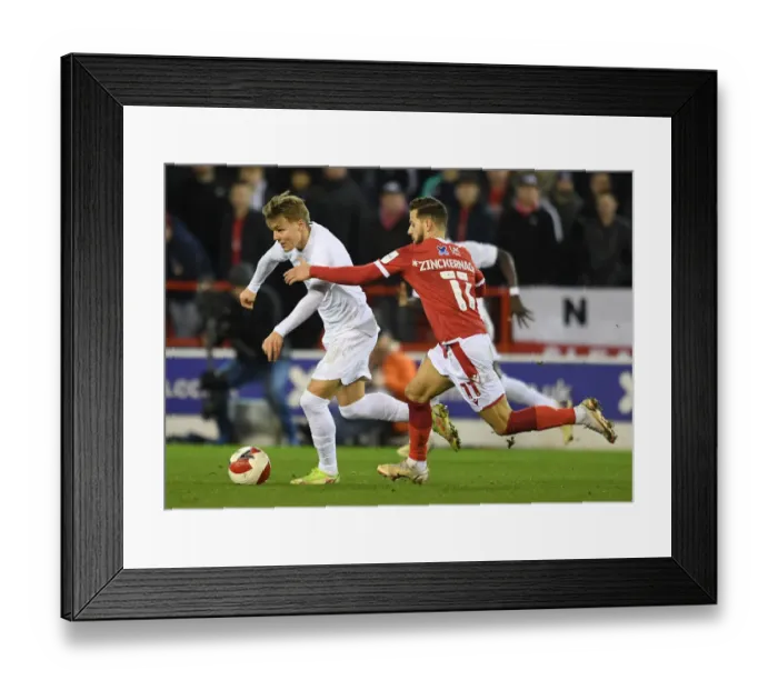 Framed Print : Arsenal's Martin Odegaard Faces Off Against Nottingham Forest's Philip Zinckernagel in FA Cup Third Round