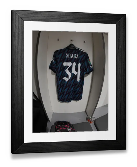 Framed Print : Arsenal's Xhaka Jersey in Anfield Changing Room - Carabao Cup Semi-Final Showdown: Liverpool vs Arsenal (2021-2022)
