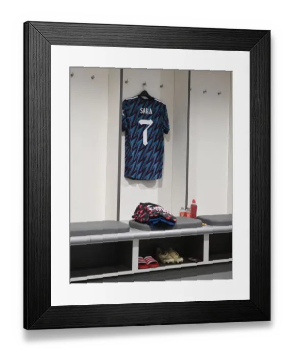 Framed Print : Bukayo Saka's Hanging Shirt in Arsenal Changing Room: Preparation for Carabao Cup Semi-Final Against Liverpool Framed Print : Bukayo Saka's Hanging Shirt in Arsenal Changing Room: Preparation for Carabao Cup Semi-Final Against Liverpool