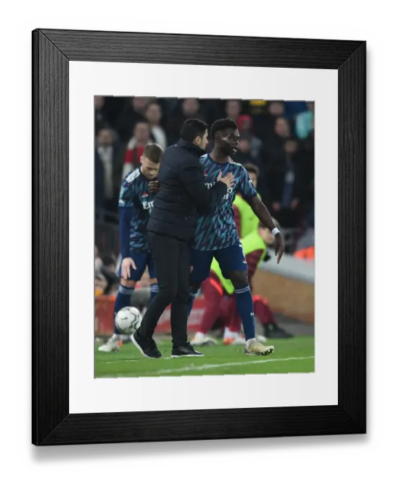 Framed Print : Arsenal Manager Mikel Arteta Guides Bukayo Saka at Liverpool's Anfield in Carabao Cup Semi-Final Framed Print : Arsenal Manager Mikel Arteta Guides Bukayo Saka at Liverpool's Anfield in Carabao Cup Semi-Final