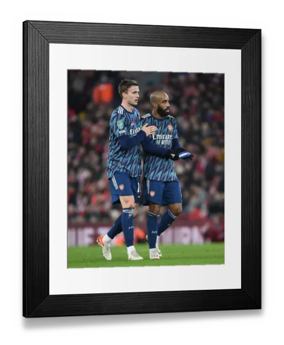Framed Print : Arsenal's Holding and Lacazette Focused at Anfield - Carabao Cup Semi-Final Showdown (Liverpool vs Arsenal 2021-22)