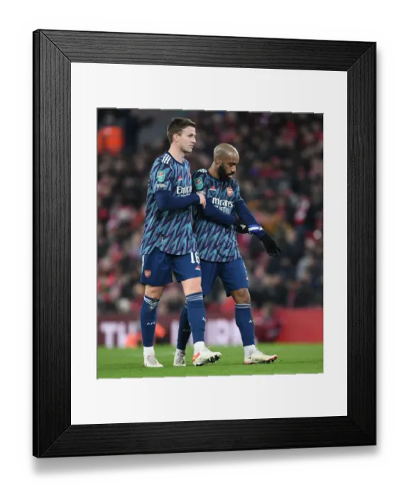 Framed Print : Arsenal's Holding and Lacazette Focused: Carabao Cup Battle at Anfield Against Liverpool