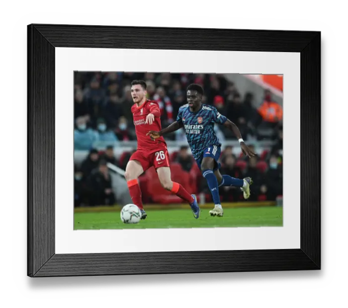 Framed Print : Bukayo Saka Closes In on Robertson: Intense Moment from Carabao Cup Semi-Final First Leg between Liverpool and Arsenal Framed Print : Bukayo Saka Closes In on Robertson: Intense Moment from Carabao Cup Semi-Final First Leg between Liverpool and Arsenal