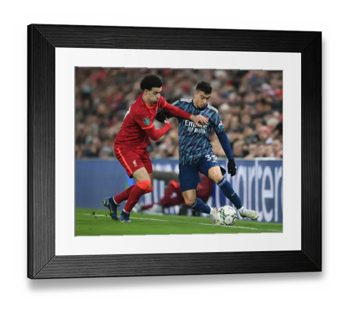 Framed Print : Gabriel Martinelli vs Curtis Jones: Intense Clash in Carabao Cup Semi-Final First Leg between Liverpool and Arsenal Framed Print : Gabriel Martinelli vs Curtis Jones: Intense Clash in Carabao Cup Semi-Final First Leg between Liverpool and Arsenal