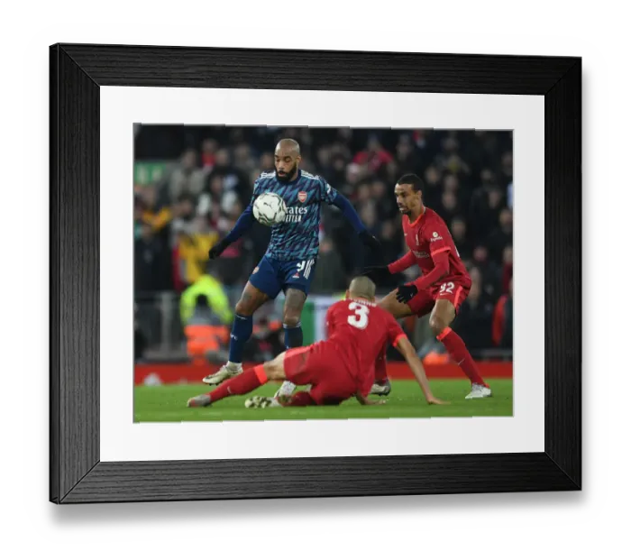 Framed Print : Lacazette vs Matip: Intense Battle in Carabao Cup Semi-Final First Leg between Liverpool and Arsenal