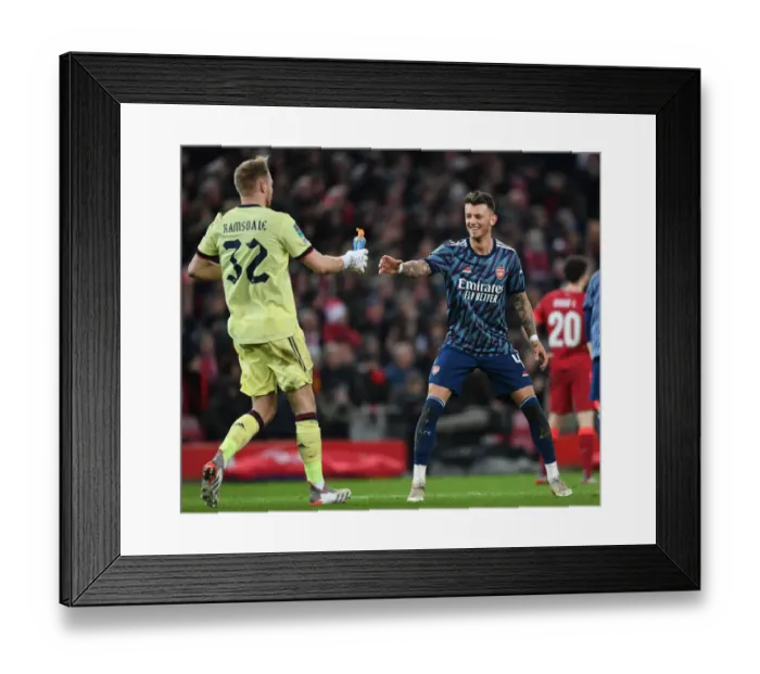 Framed Print : Arsenal's Ramsdale and White Clash Heads in Carabao Cup Semi-Final Showdown Against Liverpool