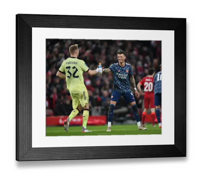 Framed Print : Arsenal's Ramsdale and White Lock Horns in Intense Carabao Cup Semi-Final Showdown Against Liverpool