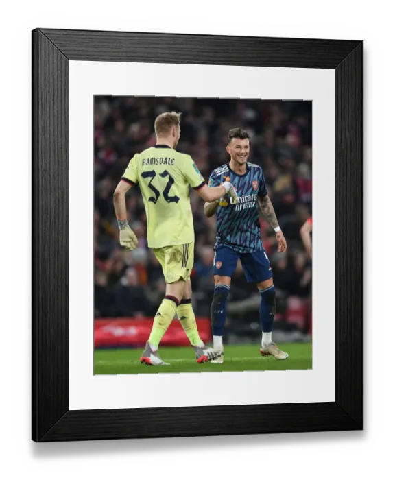Framed Print : Arsenal's Ramsdale and White Lock Horns in Intense Carabao Cup Semi-Final Battle Against Liverpool