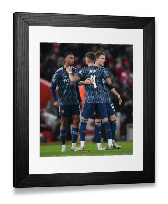 Framed Print : Arsenal Players Gabriel Magalhaes, Ben White, and Rob Holding React After Carabao Cup Semi-Final First Leg vs Liverpool