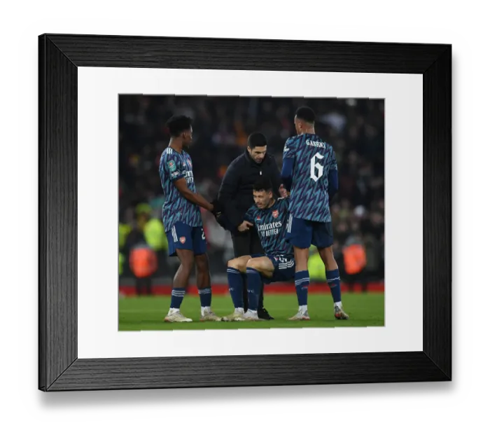 Framed Print : Arsenal's Gabriel Martinelli Receives Support from Mikel Arteta and Team after Injury in Carabao Cup Semi-Final vs Liverpool