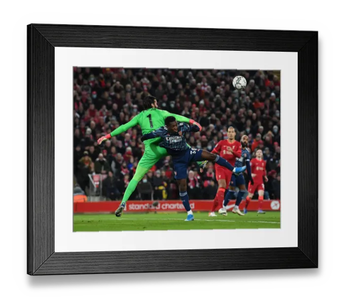 Framed Print : Arsenal's Eddie Nketiah Clashes with Liverpool's Alisson in Carabao Cup Semi-Final Framed Print : Arsenal's Eddie Nketiah Clashes with Liverpool's Alisson in Carabao Cup Semi-Final