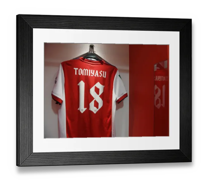 Framed Print : Arsenal's Empty Locker Room: Tomiyasu's Absence in Carabao Cup Semi-Final vs. Liverpool