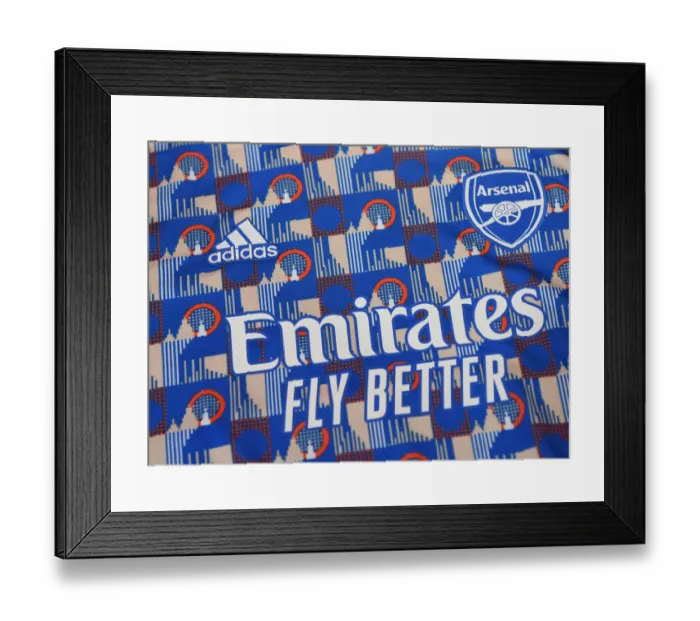 Framed Print : Arsenal Players Prepare for Carabao Cup Showdown against Liverpool: Warm-Up Session at Emirates Stadium
