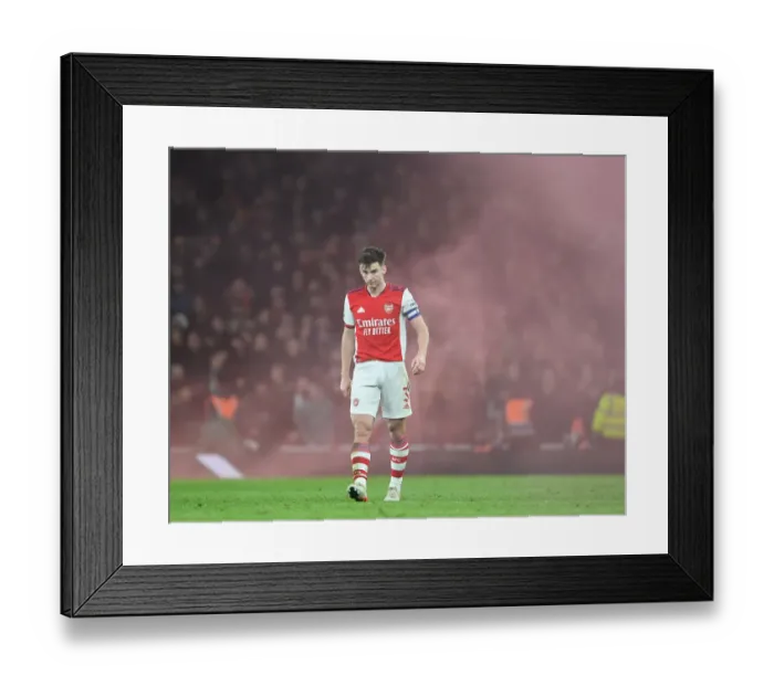 Framed Print : Arsenal's Kieran Tierney Goes Head-to-Head with Liverpool in Carabao Cup Semi-Final Clash
