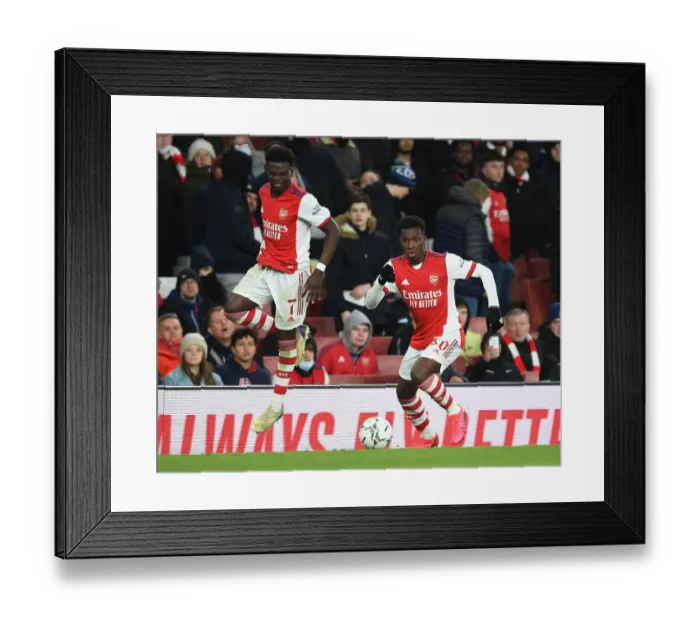 Framed Print : Arsenal's Bukayo Saka and Eddie Nketiah in Action against Liverpool in Carabao Cup Semi-Final